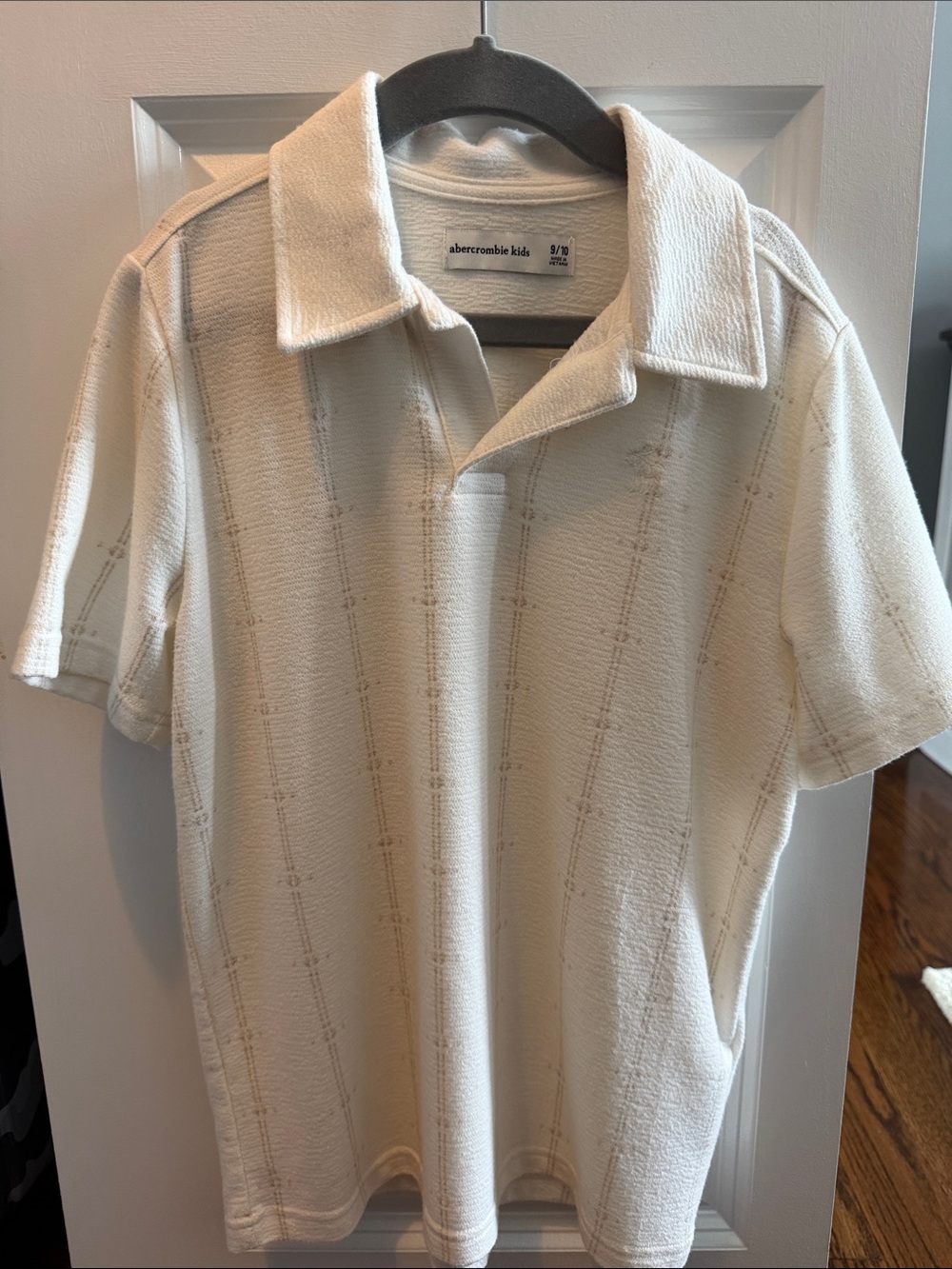 abercrombie kids cream textured short-sleeve polo with subtle tan stripe